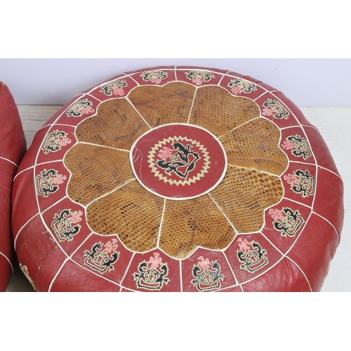 625 - Pair of leather and snakeskin patch pouffes footstools, in square and round form with coat of arms c... 