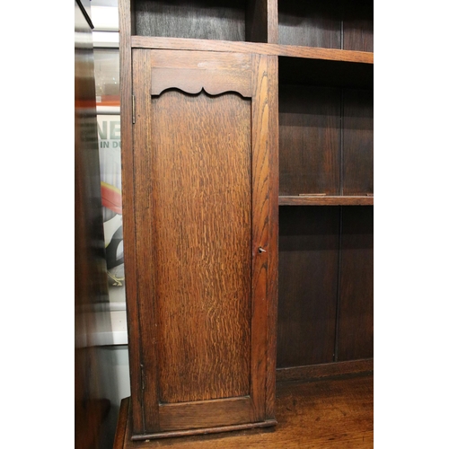 629 - Late 19th century oak sideboard, with pediment above sectional top featuring an arrangement of shelv... 