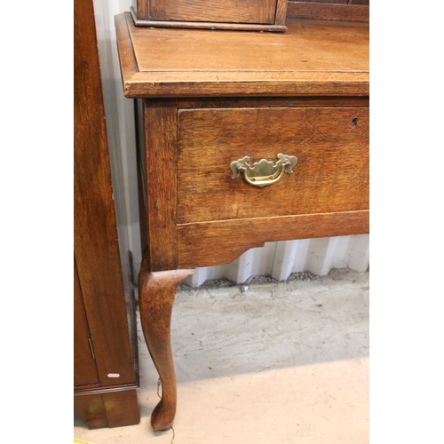 629 - Late 19th century oak sideboard, with pediment above sectional top featuring an arrangement of shelv... 