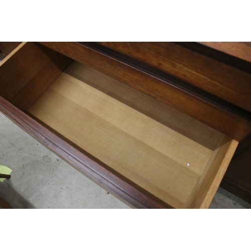 634 - Mid century teak sideboard with four drawers flanked by two pairs of cupboard doors, on square taper... 