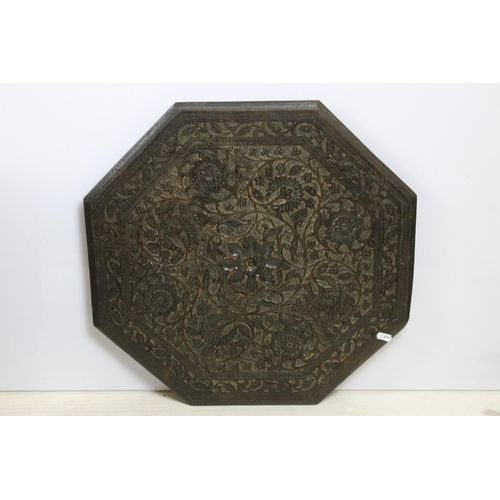 636 - Eastern carved hardwood folding octagonal occasional table, the top carved with flowers and foliage,... 