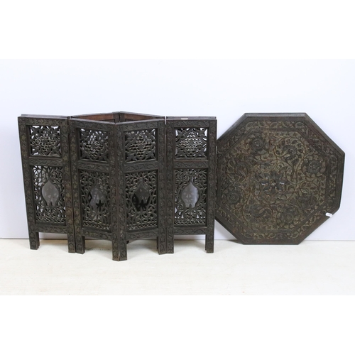 636 - Eastern carved hardwood folding octagonal occasional table, the top carved with flowers and foliage,... 