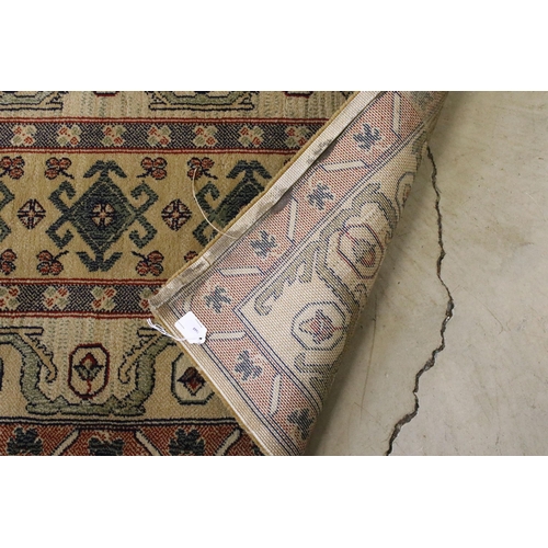 637 - Pair of 20th century cream ground wool work runners, with geometric design, each 253 x 70cm