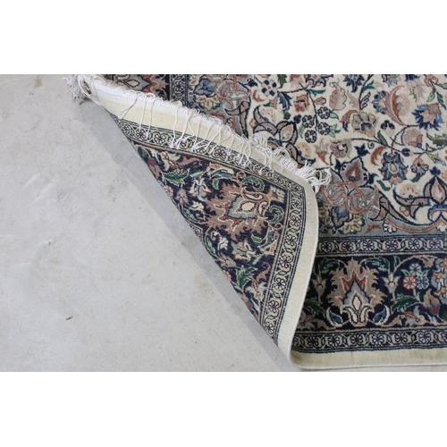 640 - 20th century wool work cream ground carpet with central medallion within borders, 213 x 140cm