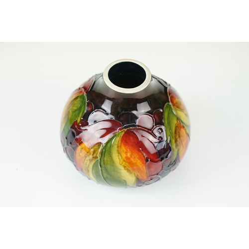 1 - William Moorcroft 'leaf and berry' pattern small vase. signed and stamped to base. H 11cm, W 11cm