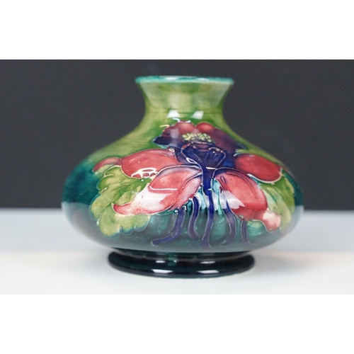 12 - William Moorcroft small floral pattern squat vase, H 6.5cm together with a Moorcroft Anemone centre ... 