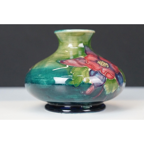 12 - William Moorcroft small floral pattern squat vase, H 6.5cm together with a Moorcroft Anemone centre ... 