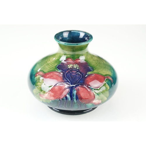 12 - William Moorcroft small floral pattern squat vase, H 6.5cm together with a Moorcroft Anemone centre ... 