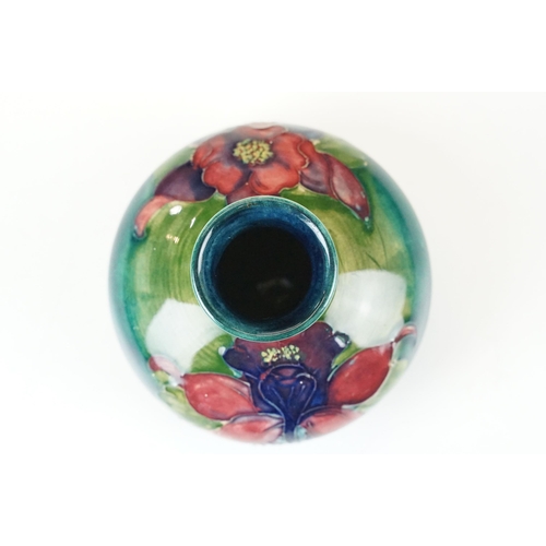 12 - William Moorcroft small floral pattern squat vase, H 6.5cm together with a Moorcroft Anemone centre ... 