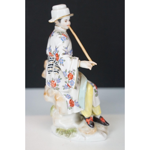 18 - Early 20th century Meissen figurine in the form of a Japanese man in floral robe with pipe, crossed ... 