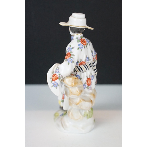 18 - Early 20th century Meissen figurine in the form of a Japanese man in floral robe with pipe, crossed ... 