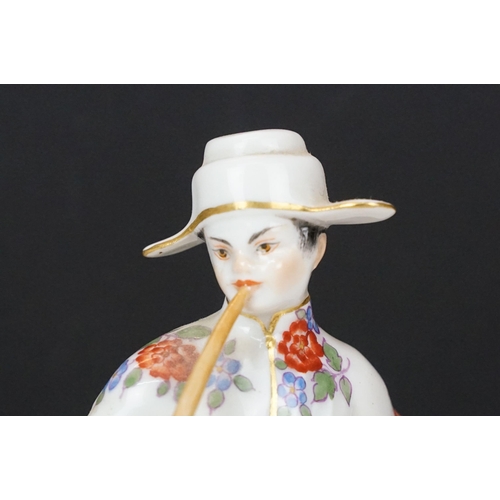 18 - Early 20th century Meissen figurine in the form of a Japanese man in floral robe with pipe, crossed ... 