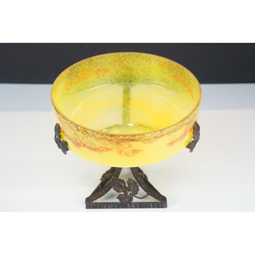 21 - Art Nouveau style large yellow marmorated glass bowl with a flat bottom resting on a wrought iron ba... 