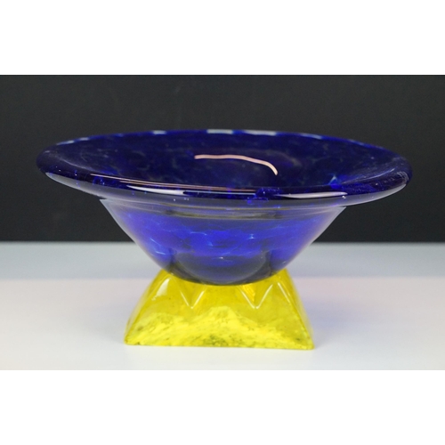 21 - Art Nouveau style large yellow marmorated glass bowl with a flat bottom resting on a wrought iron ba... 