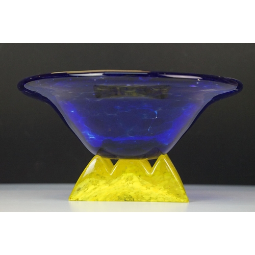 21 - Art Nouveau style large yellow marmorated glass bowl with a flat bottom resting on a wrought iron ba... 