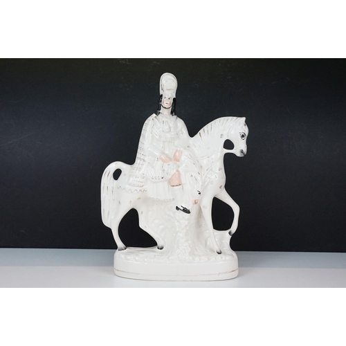 23 - Three 20th century Staffordshire flat back ornamental figurines to include man on horseback, H 37cm,... 