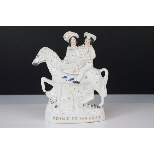 23 - Three 20th century Staffordshire flat back ornamental figurines to include man on horseback, H 37cm,... 