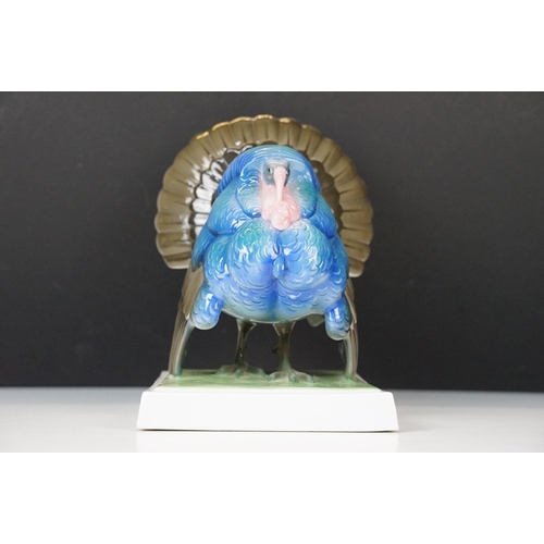 3 - Fraureuth blue painted Turkey ceramic figurine on a rectangular green plinth, marked to base, H 19cm... 