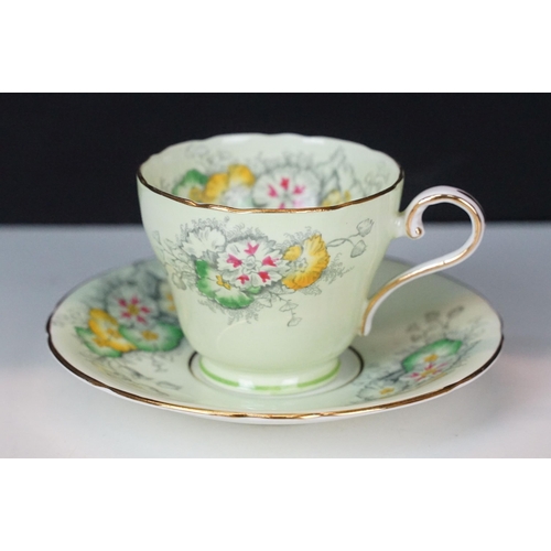 37 - Set of five Aynsley Dianthus on light green and gilt edge coffee cups and saucers together with lidd... 