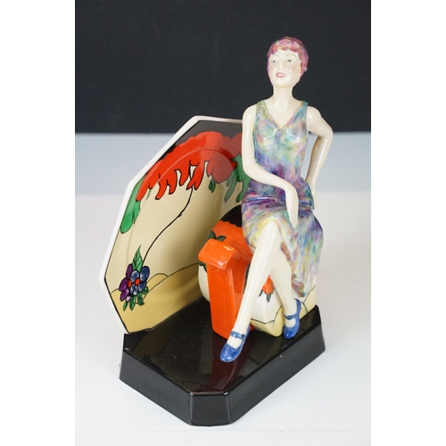 4 - 'Tea with Clarice Cliff' figurine sculpture with Clarice Cliff seated on an Art Deco tea pot against... 