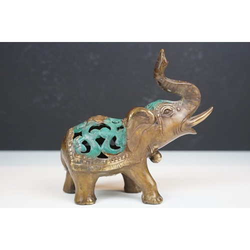 50 - Two cast metal elephants with turquoise detailing together with two Middle Eastern art enamelled cop... 