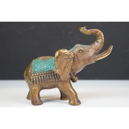 50 - Two cast metal elephants with turquoise detailing together with two Middle Eastern art enamelled cop... 