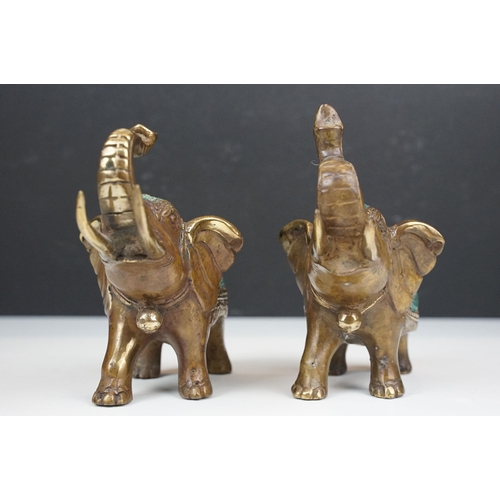 50 - Two cast metal elephants with turquoise detailing together with two Middle Eastern art enamelled cop... 