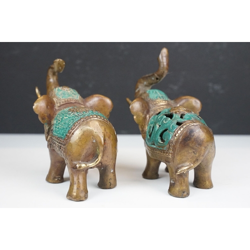 50 - Two cast metal elephants with turquoise detailing together with two Middle Eastern art enamelled cop... 