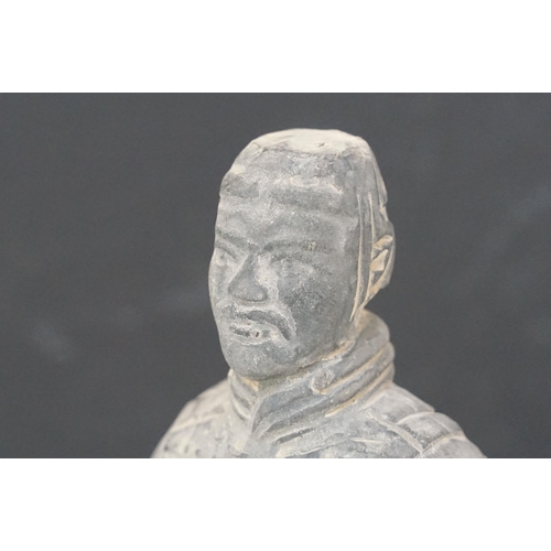 67 - Two Chinese terracotta warrior soldier figurines on square bases, H 20.5cm