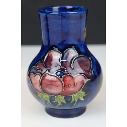 73 - Moorcroft pottery 'Anemone' small baluster vase, H 10.5cm and taller vase, H 13cm with sticker and s... 