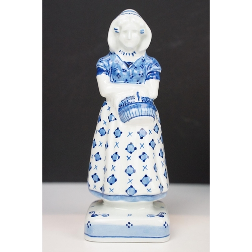 74 - Focke and Meltzer Delft ware lady with basket figurine 'De Porceleyne Fles', H 16cm