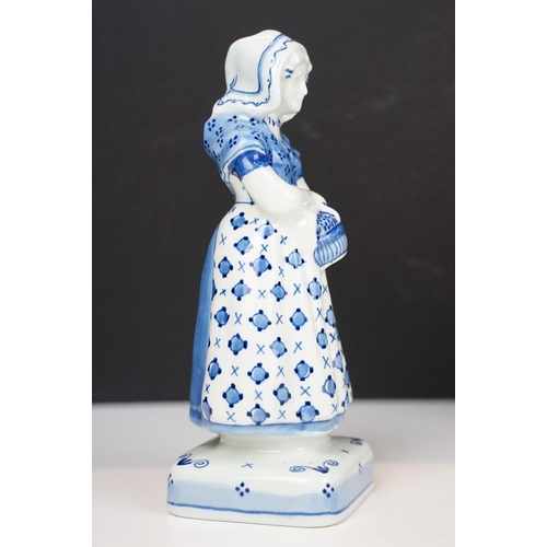 74 - Focke and Meltzer Delft ware lady with basket figurine 'De Porceleyne Fles', H 16cm