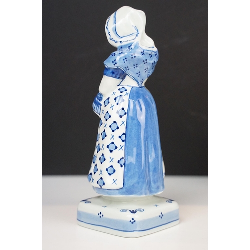 74 - Focke and Meltzer Delft ware lady with basket figurine 'De Porceleyne Fles', H 16cm