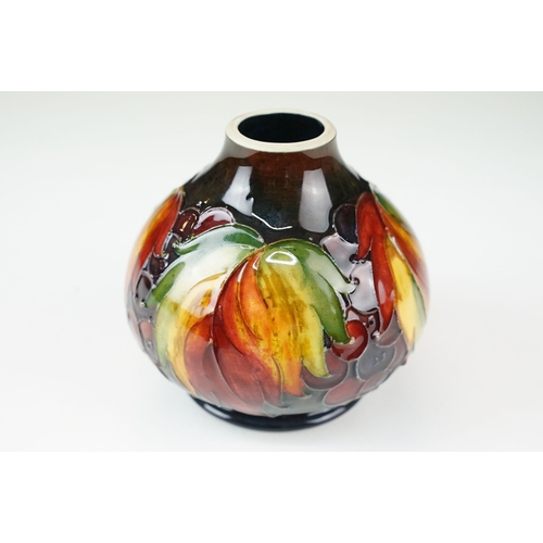 1 - William Moorcroft 'leaf and berry' pattern small vase. signed and stamped to base. H 11cm, W 11cm