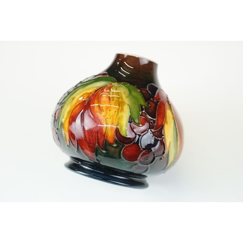 1 - William Moorcroft 'leaf and berry' pattern small vase. signed and stamped to base. H 11cm, W 11cm