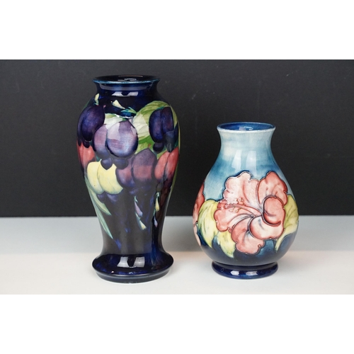 16 - Moorcroft 'Wisteria' vase H 18cm together with a Moorcroft 'Hibiscus' footed baluster form vase H 13... 