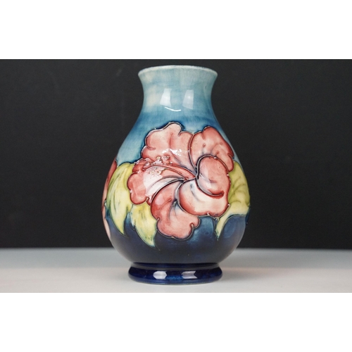 16 - Moorcroft 'Wisteria' vase H 18cm together with a Moorcroft 'Hibiscus' footed baluster form vase H 13... 