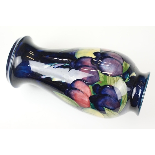 16 - Moorcroft 'Wisteria' vase H 18cm together with a Moorcroft 'Hibiscus' footed baluster form vase H 13... 