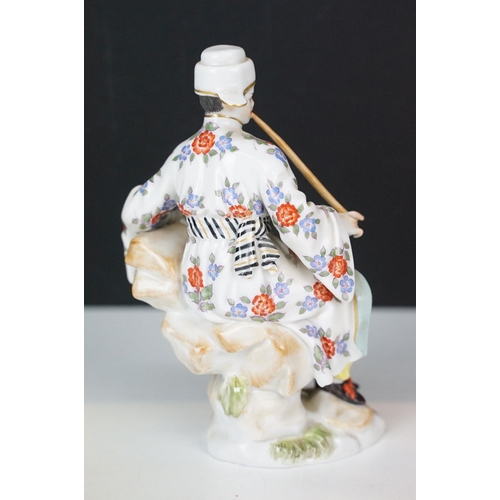 18 - Early 20th century Meissen figurine in the form of a Japanese man in floral robe with pipe, crossed ... 