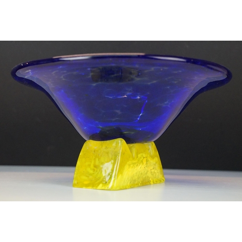 21 - Art Nouveau style large yellow marmorated glass bowl with a flat bottom resting on a wrought iron ba... 