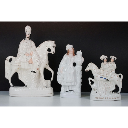 23 - Three 20th century Staffordshire flat back ornamental figurines to include man on horseback, H 37cm,... 