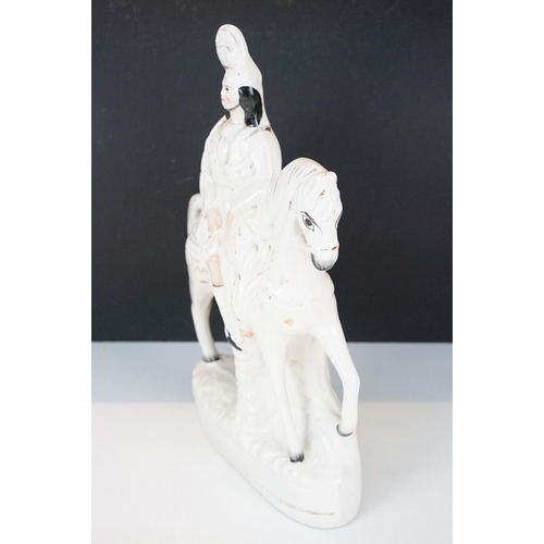 23 - Three 20th century Staffordshire flat back ornamental figurines to include man on horseback, H 37cm,... 