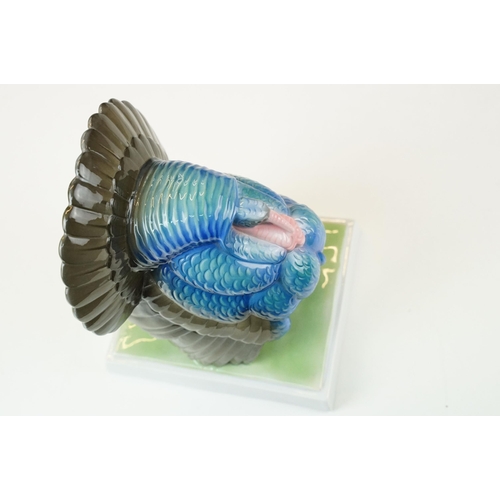 3 - Fraureuth blue painted Turkey ceramic figurine on a rectangular green plinth, marked to base, H 19cm... 