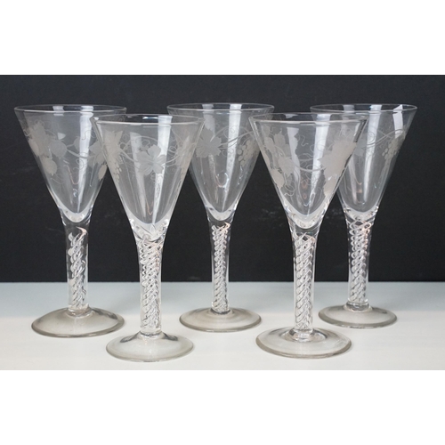 40 - Group of five Victorian hand blown fluted glasses with vine leaf etched detailing and double twist s... 