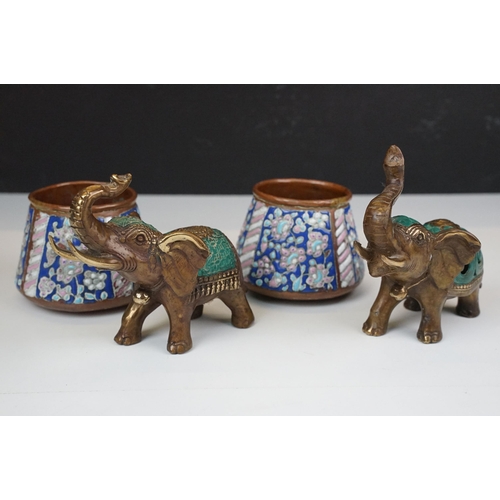 50 - Two cast metal elephants with turquoise detailing together with two Middle Eastern art enamelled cop... 