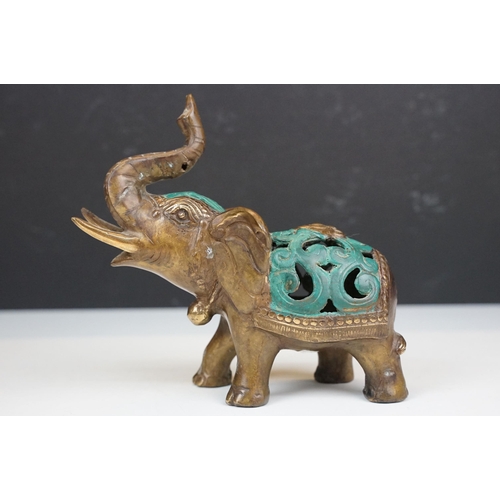 50 - Two cast metal elephants with turquoise detailing together with two Middle Eastern art enamelled cop... 