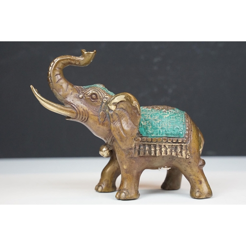 50 - Two cast metal elephants with turquoise detailing together with two Middle Eastern art enamelled cop... 