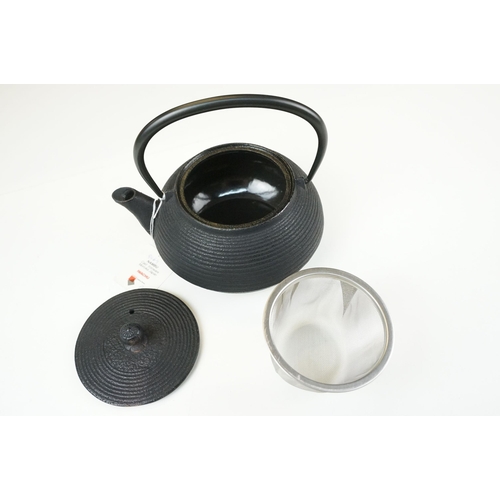 61 - Iwachu Nambu Japanese cast ironware teapot and stand, boxed