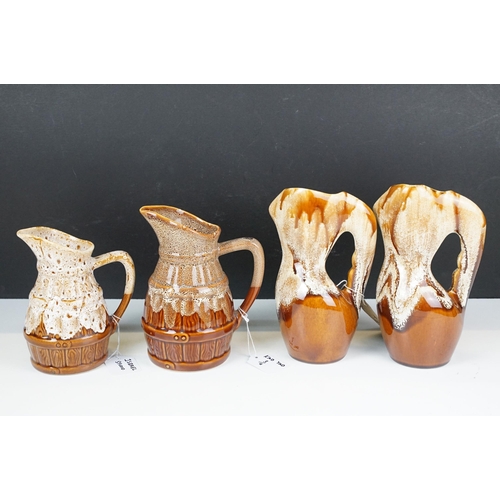 65 - Kad Yad studio pottery, 1970's, four pieces, to include a pair of twisted form handled vases, H 23cm... 