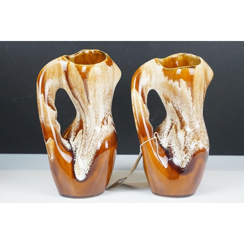 65 - Kad Yad studio pottery, 1970's, four pieces, to include a pair of twisted form handled vases, H 23cm... 